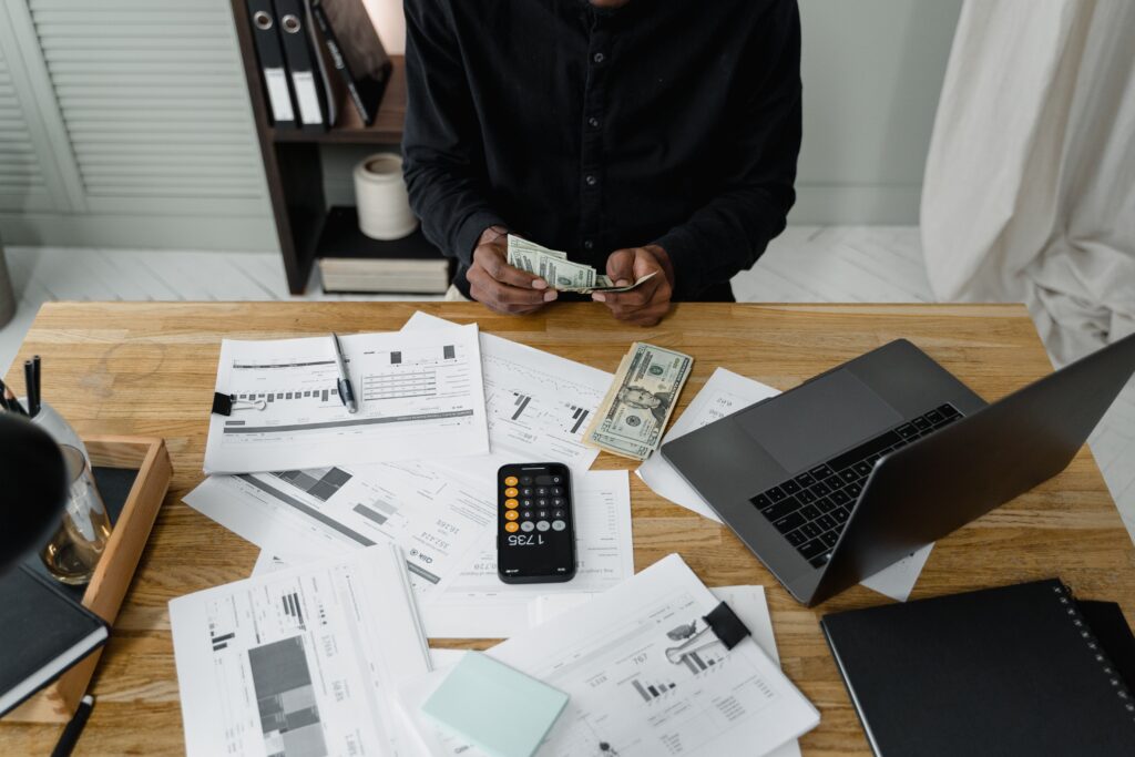 Finance team reviewing immigration costs and approvals in Nigeria
